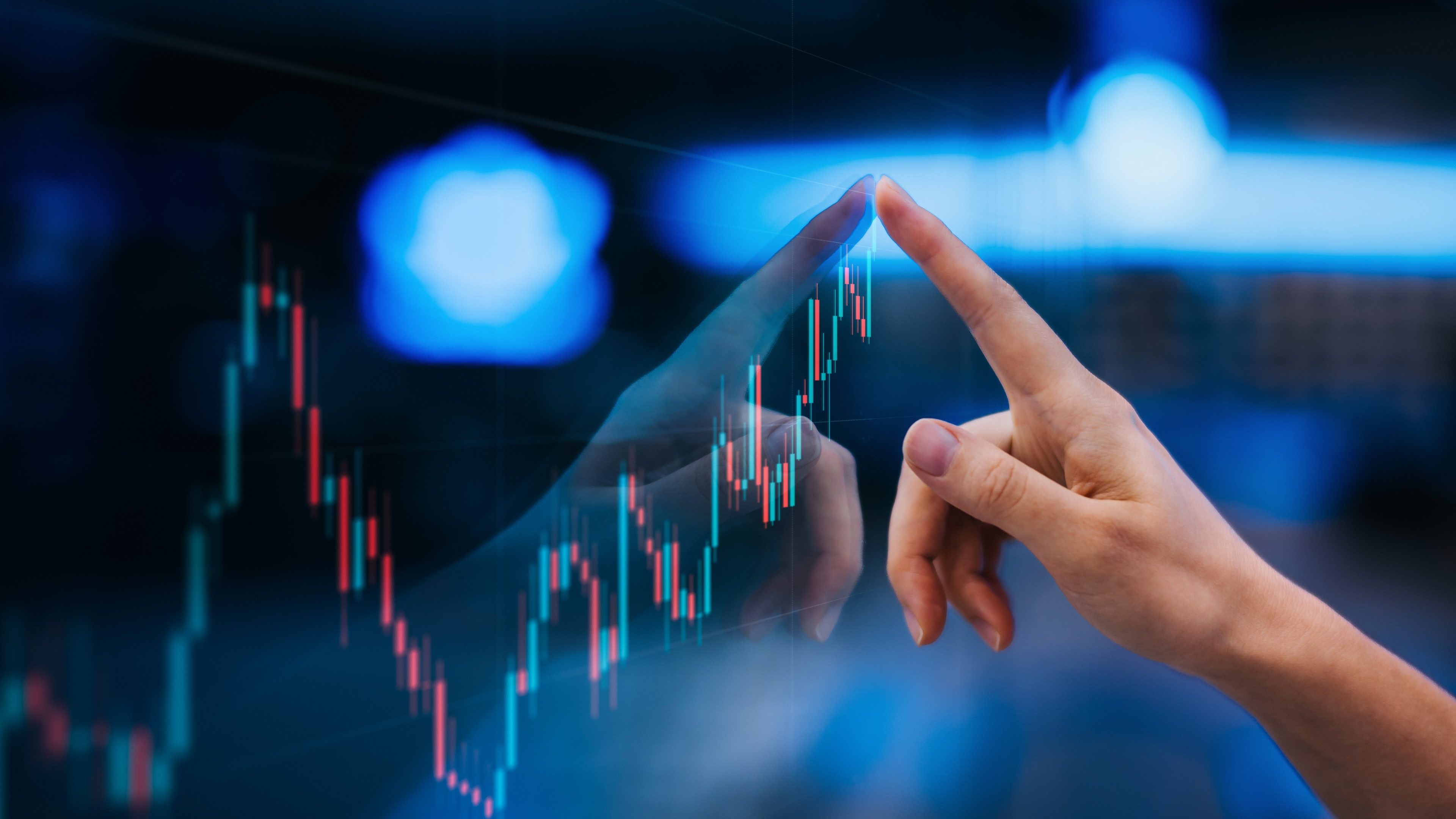 Close up of female hand touching stock market analysis digital display screen TradingView chart, analyzing investment and financial trading data in candlestick chart on a touch screen interface. Business and finance. Investment on NFT and cryptocurrency concept