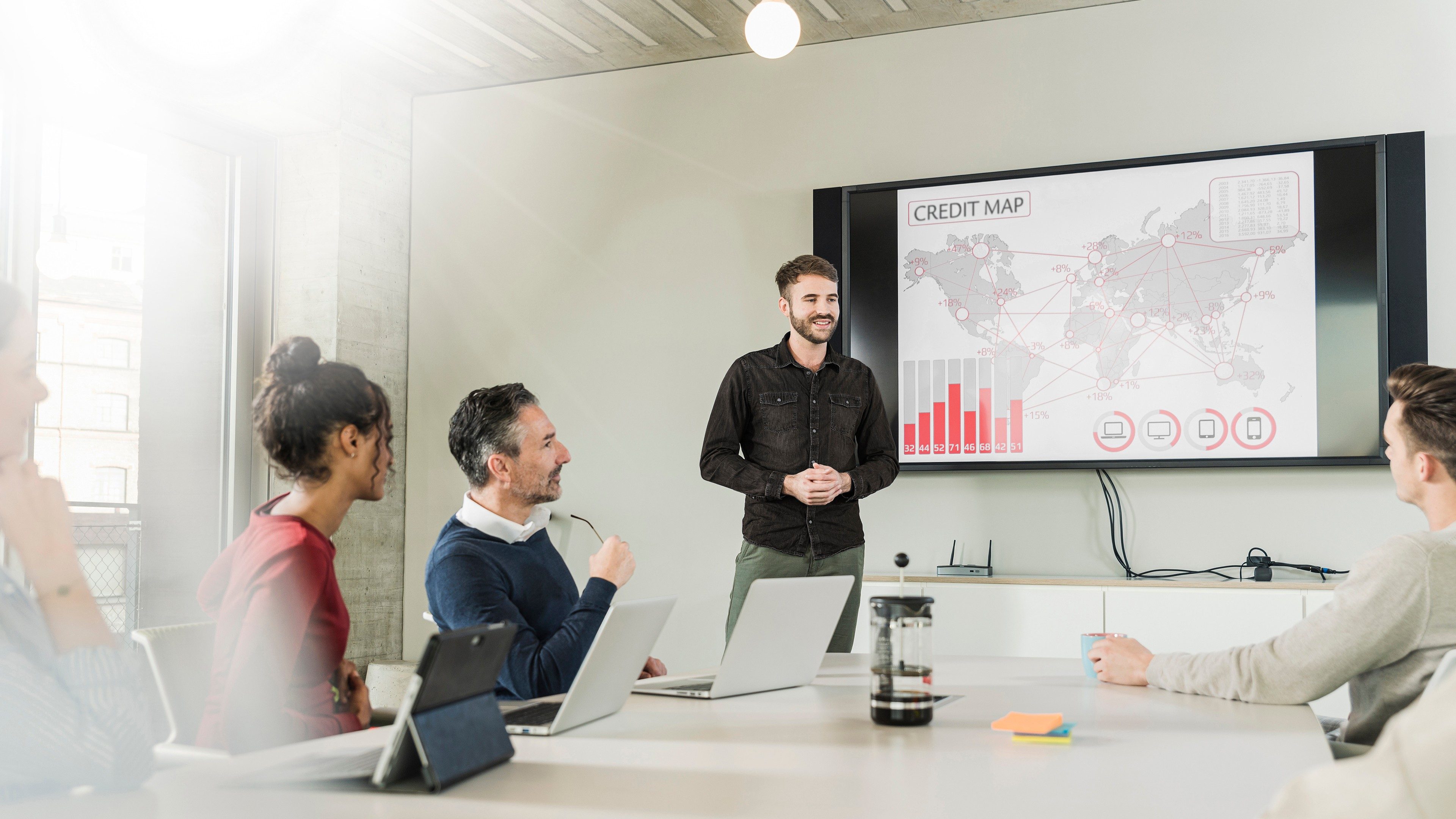 Young businessman leading a presentation in boardroom