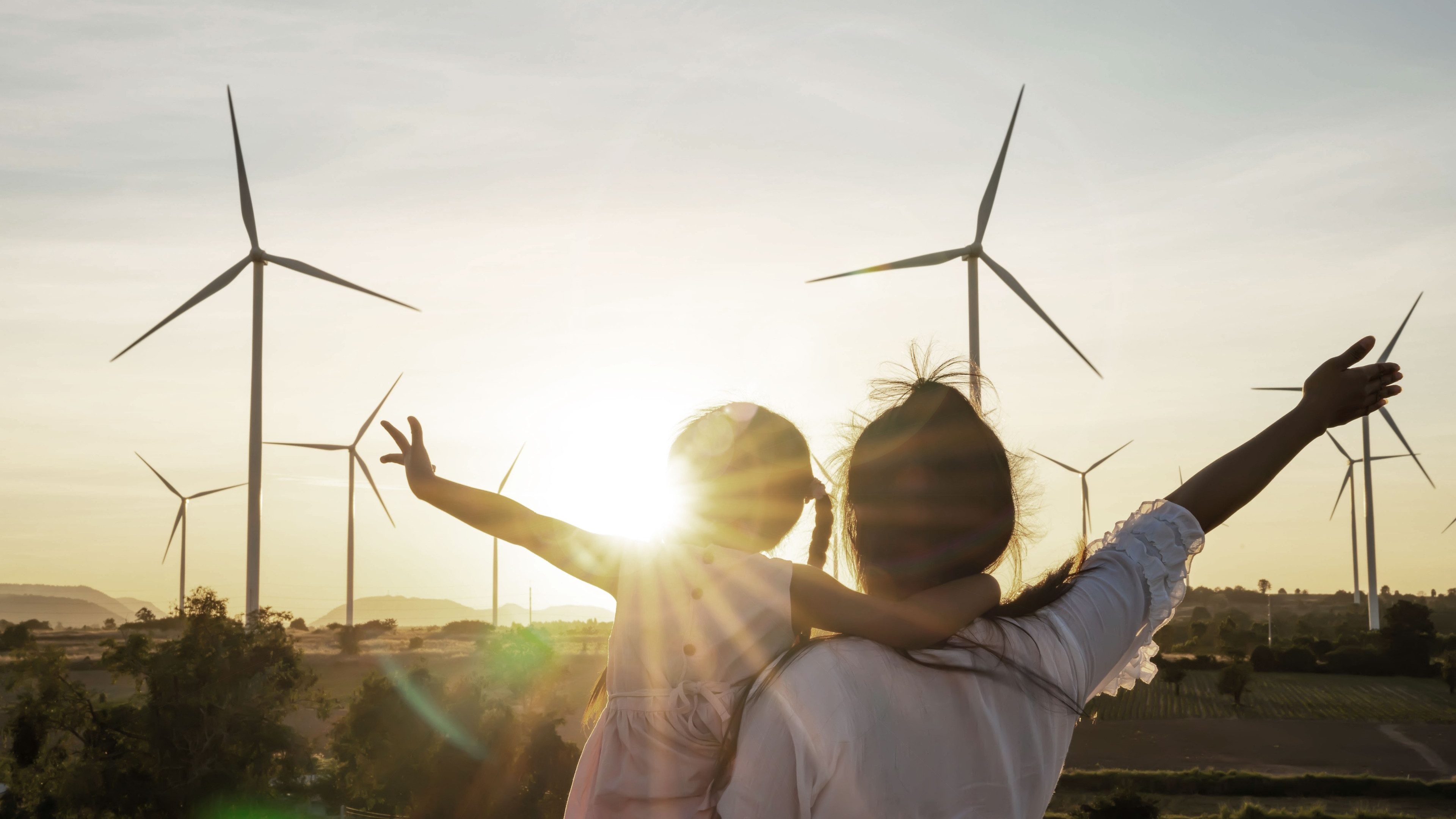 Wind turbines are alternative electricity sources, the concept of sustainable resources, People in the community with wind generators turbines, Renewable energy.