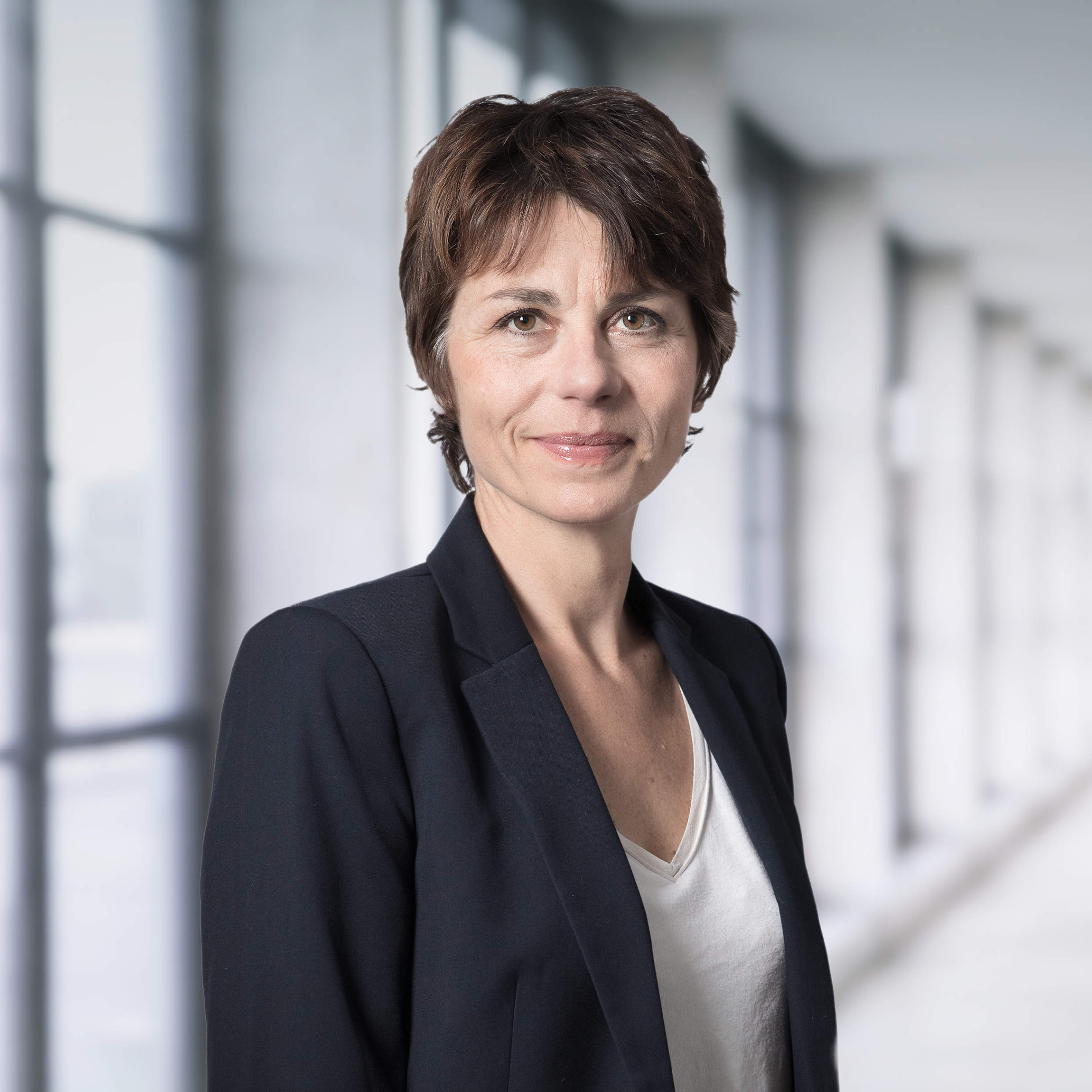 Portrait de Marie Brive, Directrice des Ressources Humaines de Swiss Life AM France, accompagnant une citation sur l'importance de la coopération et de la bienveillance au travail.