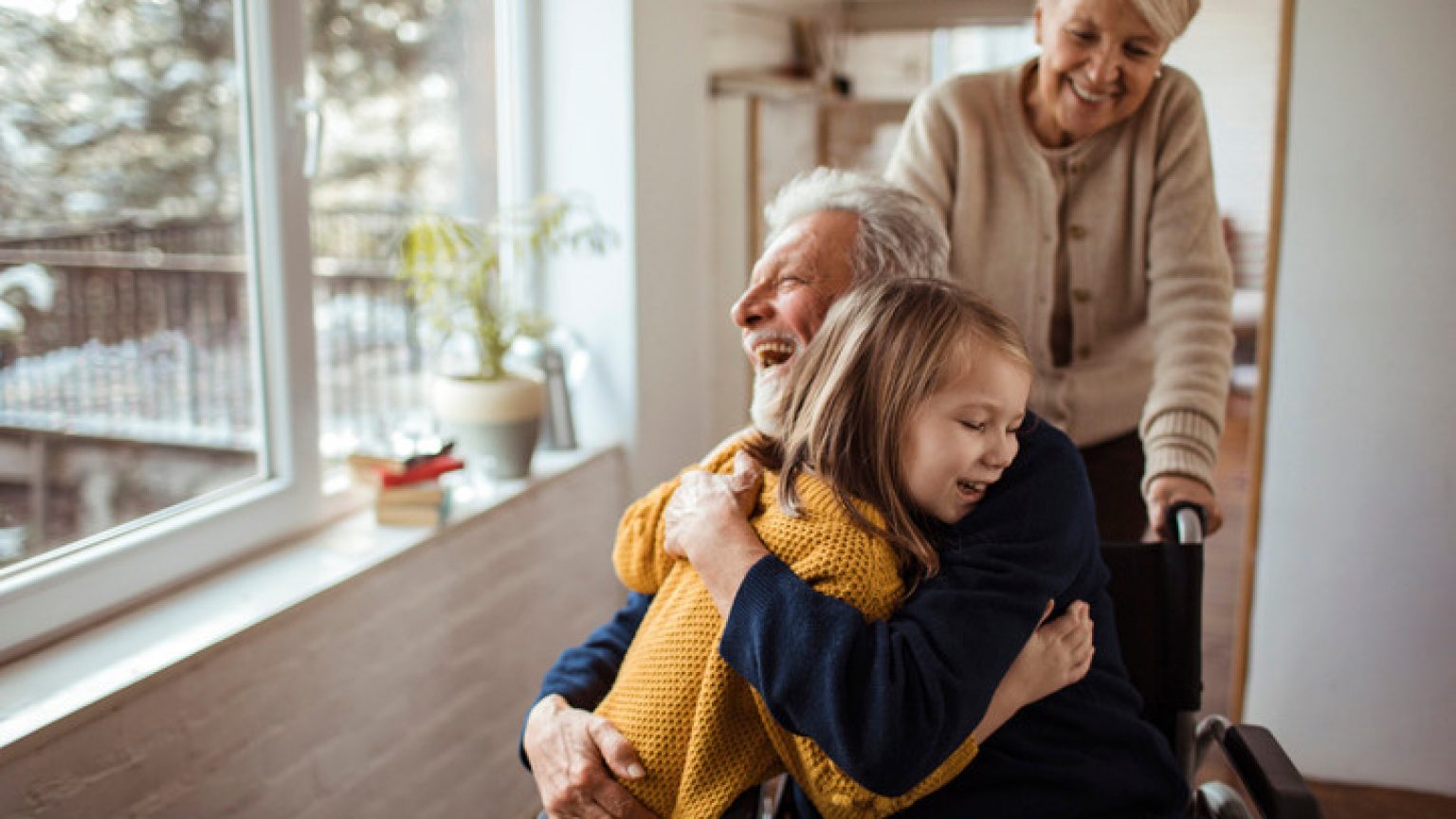 Close up of a multi generational family enjoying time together at home during the winter
