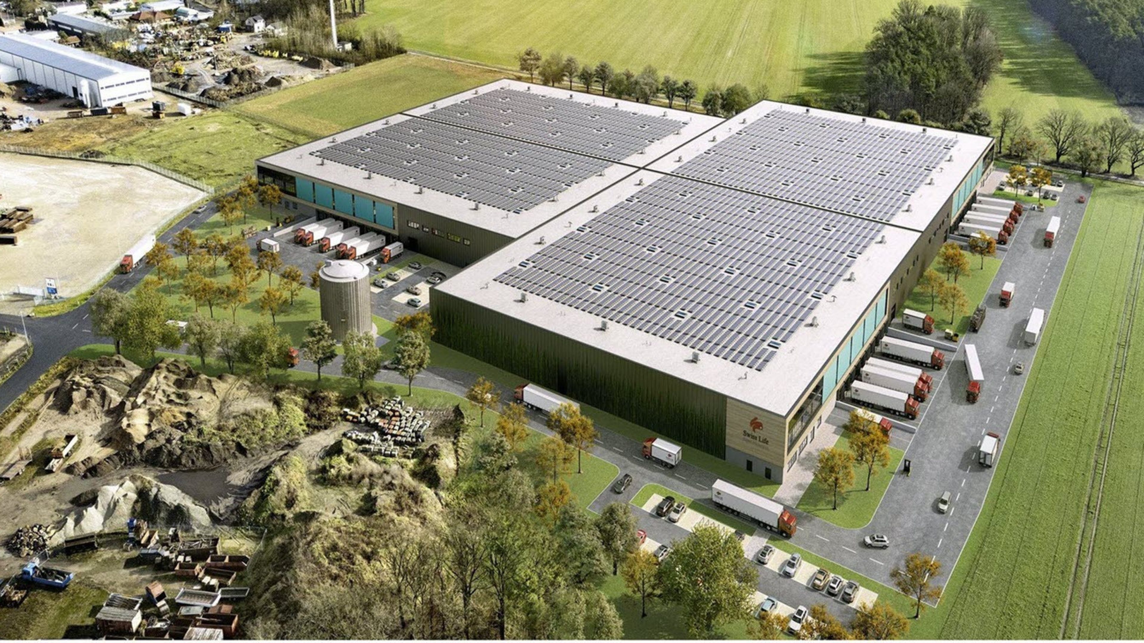 Un immeuble logistique à Hanovre avec des camions.